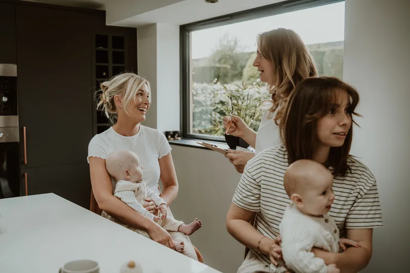 A Memory Catcher taking prints for two mums and their babies at a home session