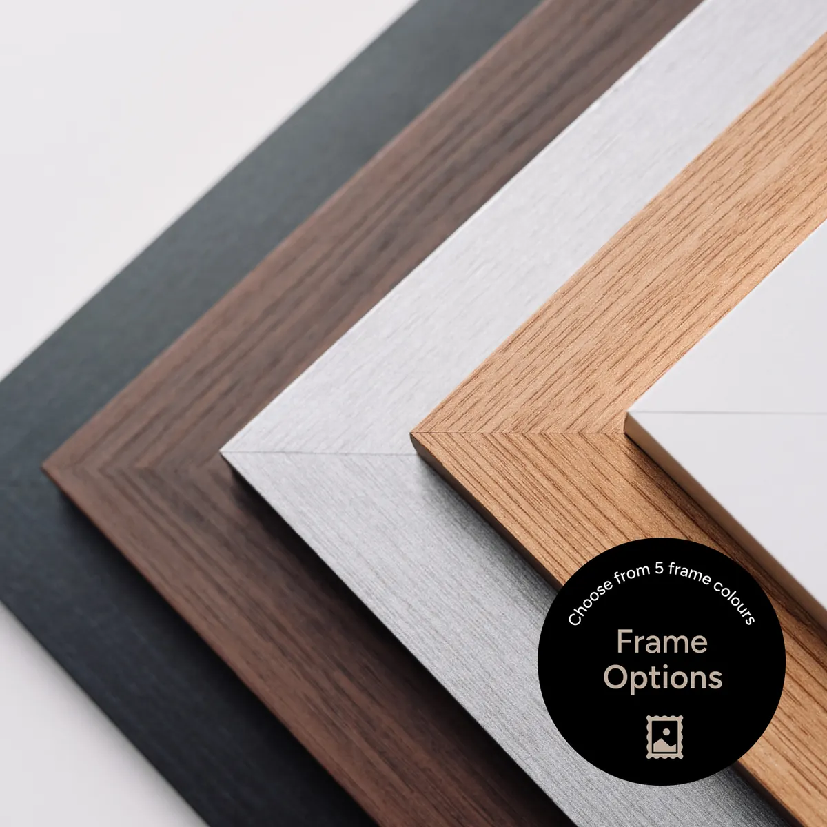 Four frame colour options for the foil print kit - black, walnut, white and oak wood grain