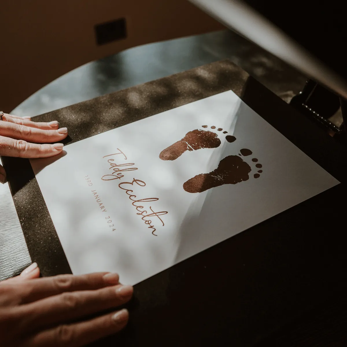 A foil footprint print being lifted from its packaging