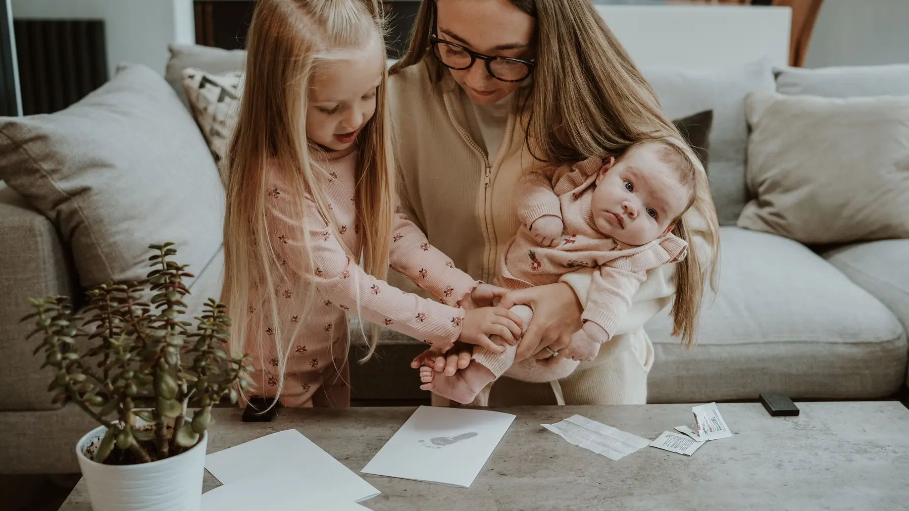A mother and baby making prints at home