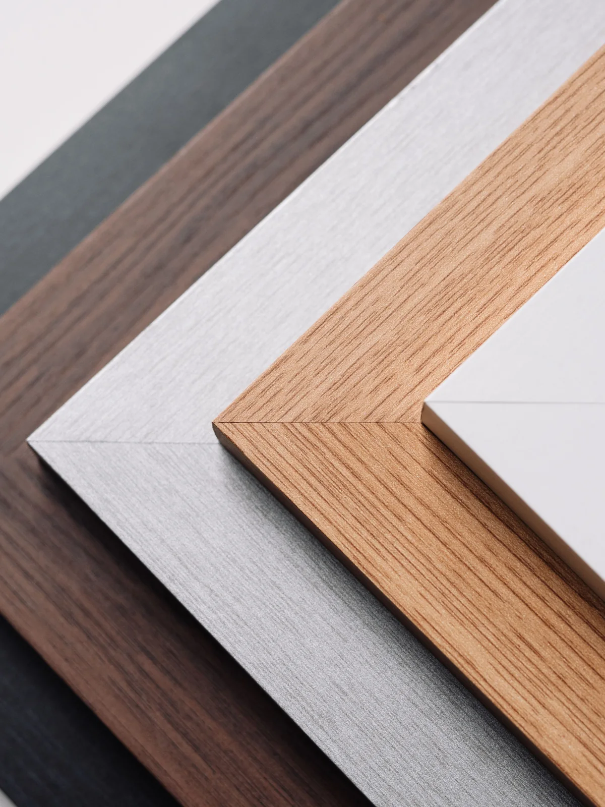 Frame corner samples in black, walnut, ash, oak and white