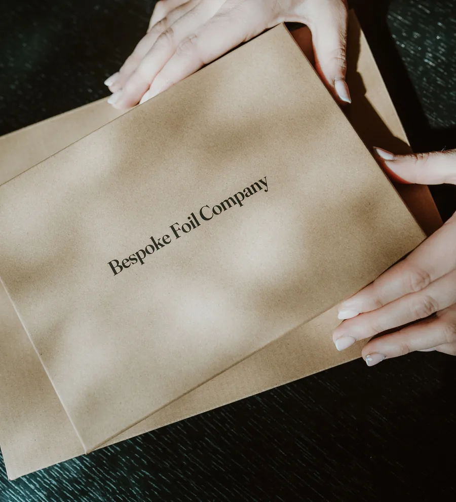 Kraft packaging being wrapped by hand