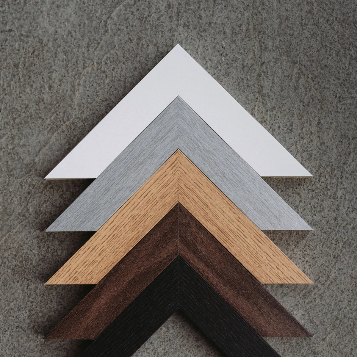 Our five frame finishes, from white to black